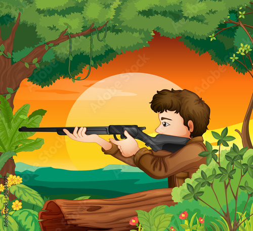 A man with a gun at the woods