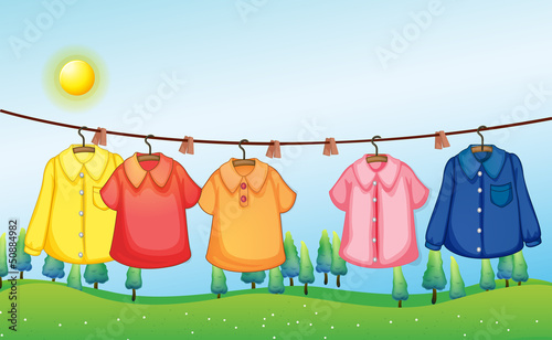 Washed clothes hanging under the sun