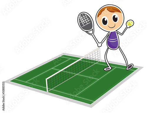 A young boy playing tennis