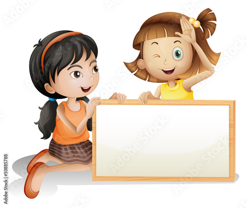 Two girls with a blank white board