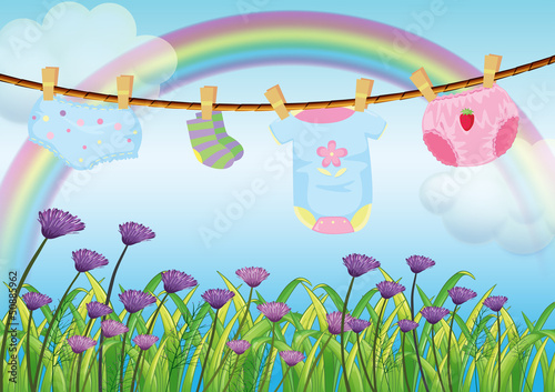 A child's clothes hanging above the garden