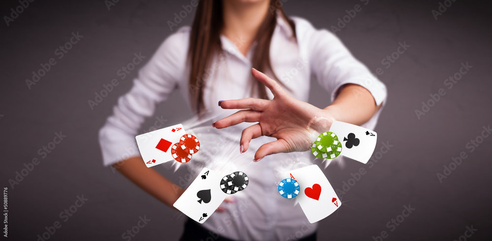 Young woman playing with poker cards and chips Young woman playing with poker cards and chips