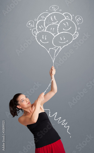 Happy woman holding smiling balloons drawing