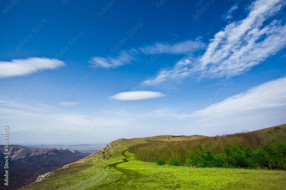 Summer landscape in mountains and the dark blue sky with clouds Summer landscape in mountains and the dark blue sky with clouds