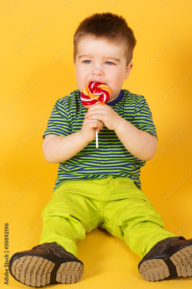 Little baby boy with motleyl candy Little baby boy with motleyl candy