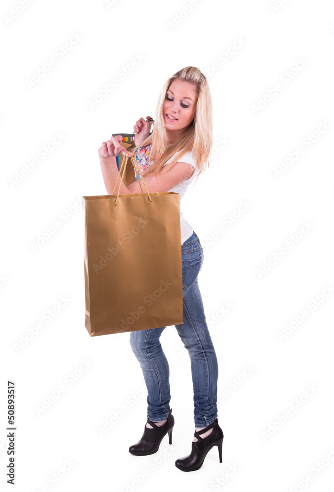 Fototapeta premium Smiling girl in shop with shopping bags 