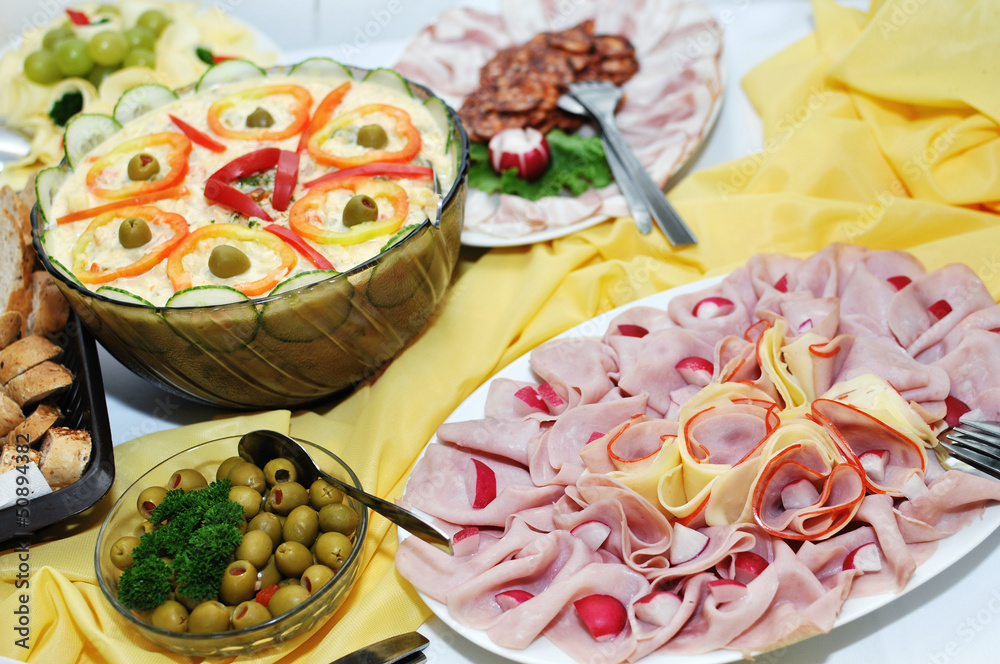 platters of ham, cheese, salad