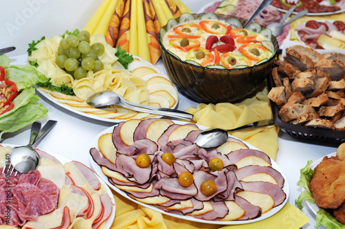 platters of ham, cheese, salad