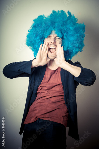vintage portrait of fashion guy with curly blue wig