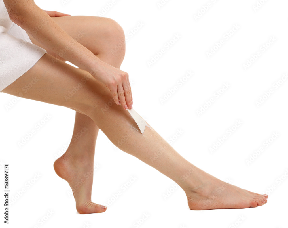 Beautiful woman legs with depilation cream, isolated on white Beautiful woman legs with depilation cream, isolated on white