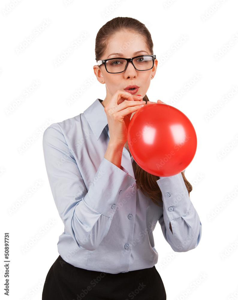 Girl inflating a red ball Girl inflating a red ball