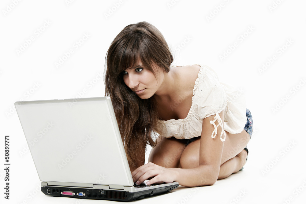 Young woman working with laptop on white background Young woman working with laptop on white background