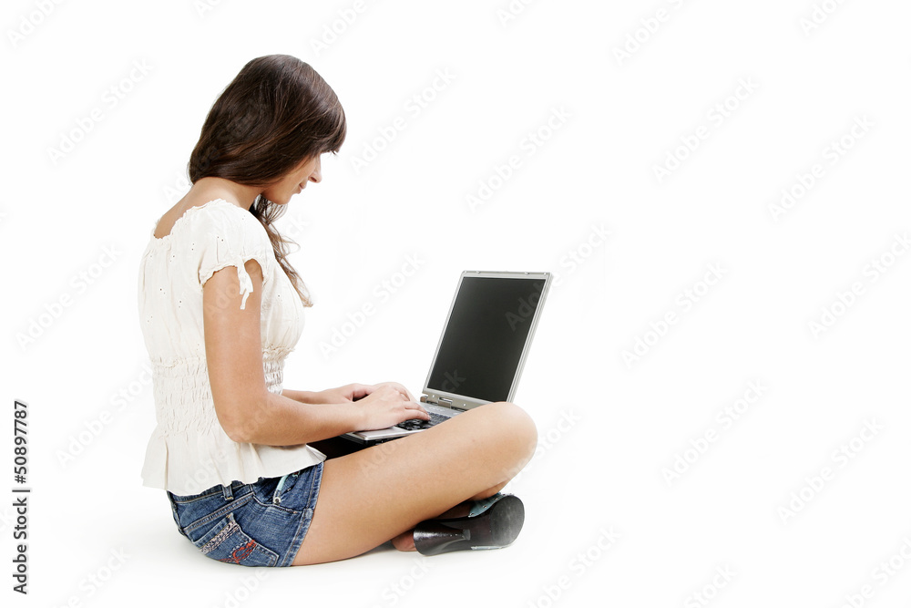 Young woman working with laptop on white background Young woman working with laptop on white background