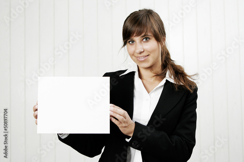 Smiling woman holding an empty card photo