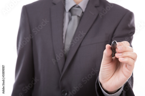 Businessman writing on copy space against white background