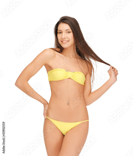 beautiful woman in bikini playing with hair