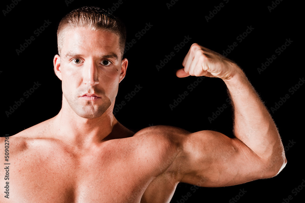 Muscular man isolated on black background Muscular man isolated on black background