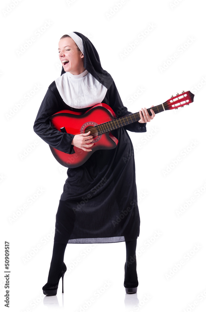 Nun playing guitar isolated on white Nun playing guitar isolated on white