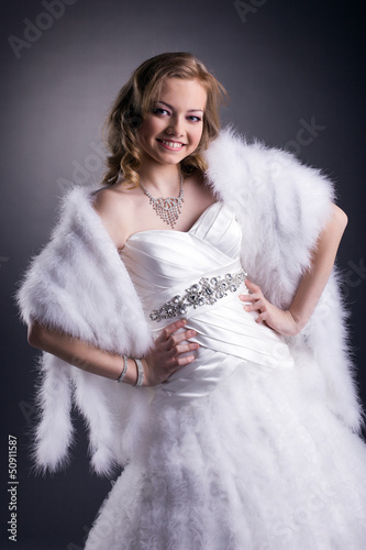 Portrait of smiling bride posing in studio