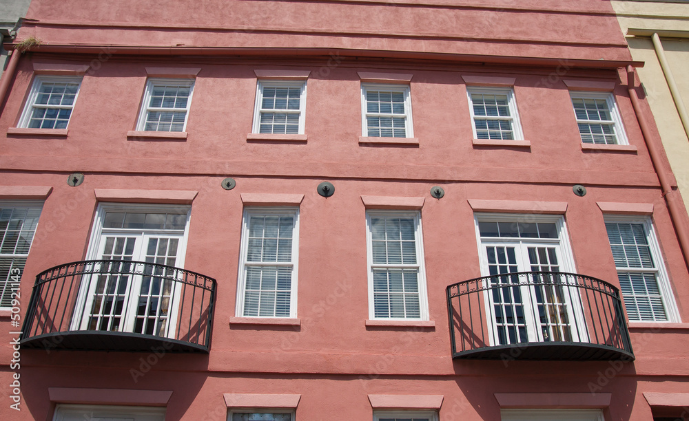 Black Iron Balconies on Red Plaster Building Black Iron Balconies on Red Plaster Building