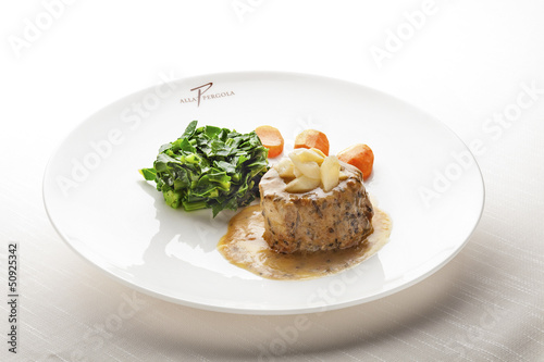 Juicy Fillet Mignon served with Sauce and Vegetables
