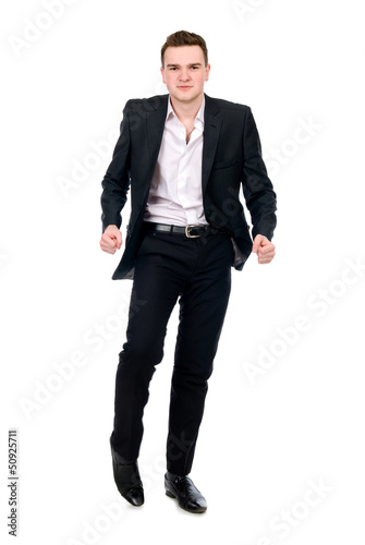 Young man in suit dancing.