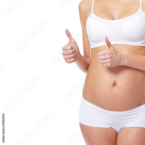 Young attractive pregnant woman with the beautiful belly over wh