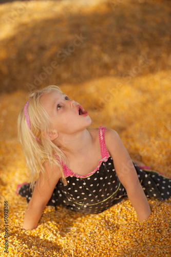 Young Child in Fall Harvest Corn