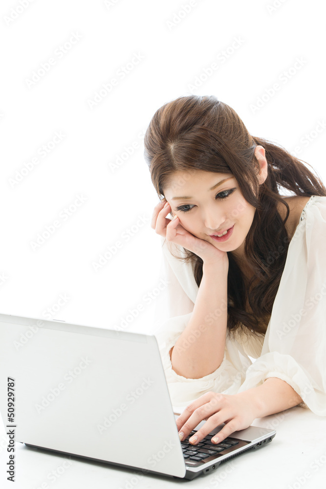 Beautiful young woman using a laptop computer Beautiful young woman using a laptop computer