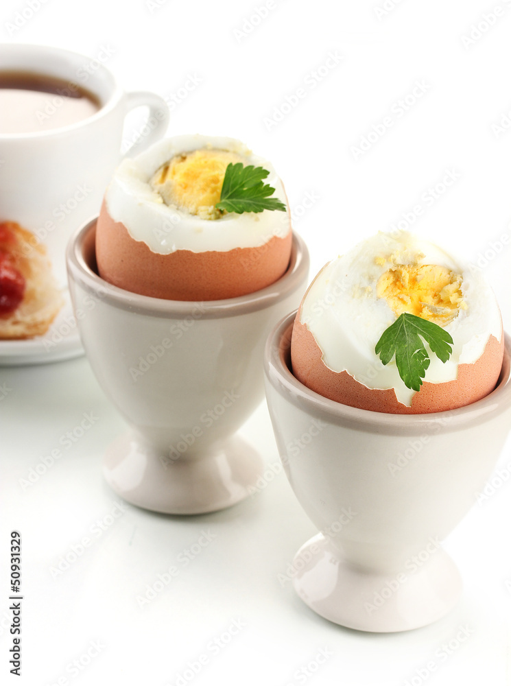 Light breakfast with boiled eggs and coffee, isolated on white Light breakfast with boiled eggs and coffee, isolated on white