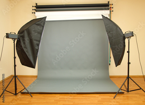 Empty photo studio with lighting equipment