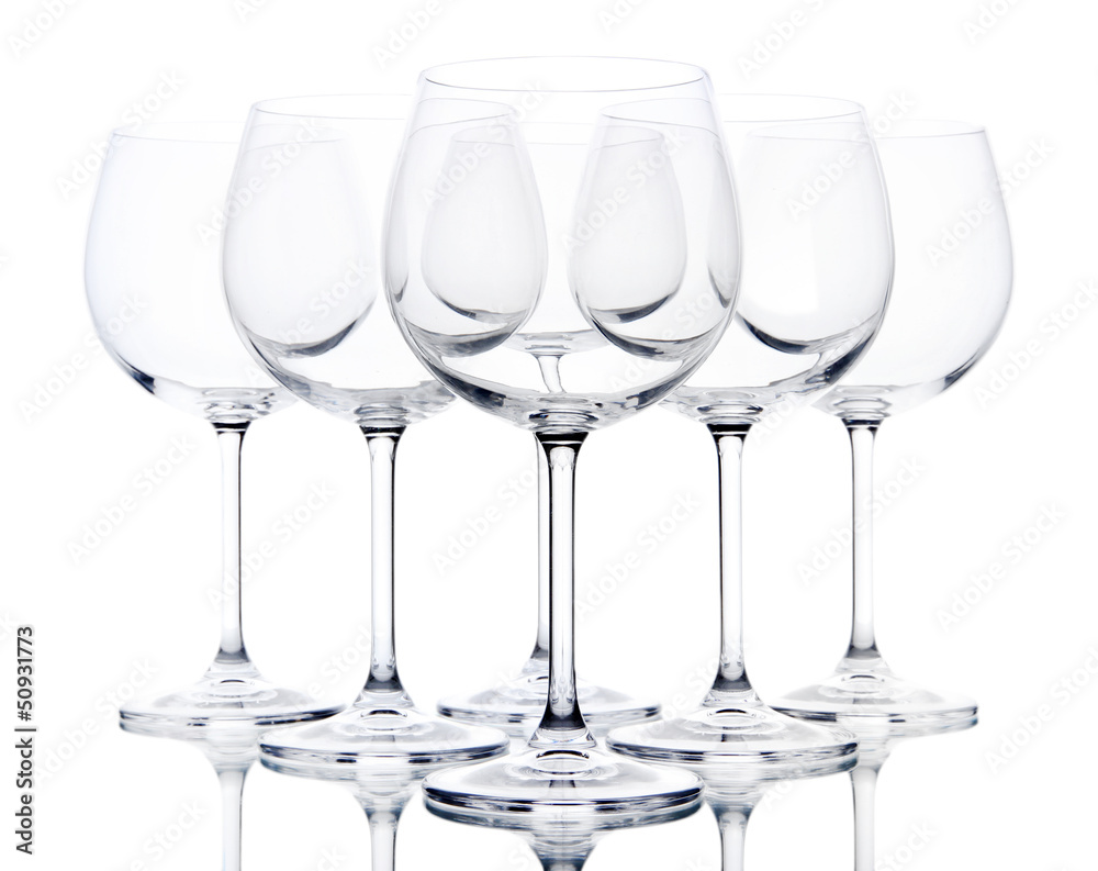 Empty wine glasses arranged and isolated on white