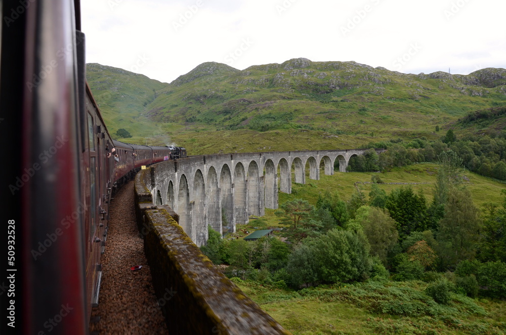 Jacobite steam train crossing Glenfinnan viaduct