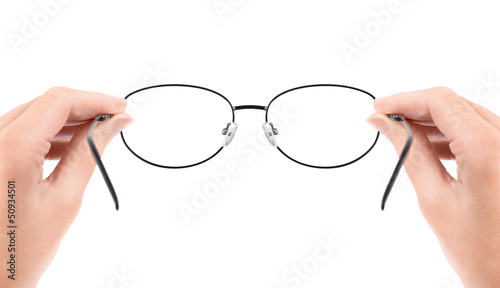 Woman holding glasses in hands photo