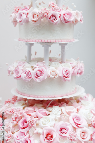 Delicious wedding cake decorated with roses