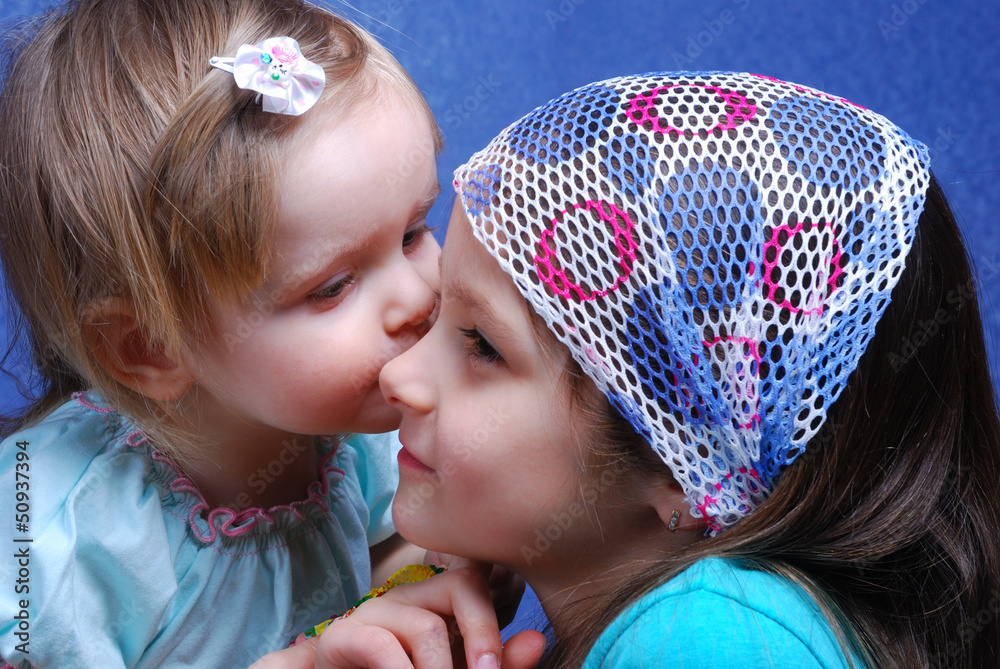 Two sisters are dressed up as fairies.