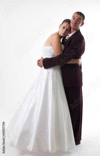 Bride and groom hug
