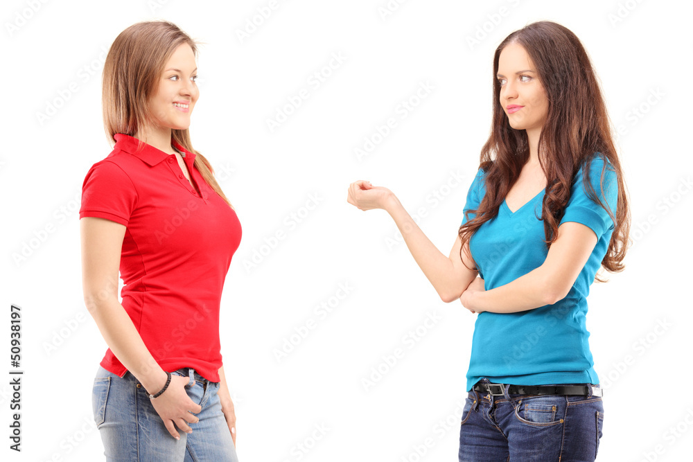 Two young females having a conversation