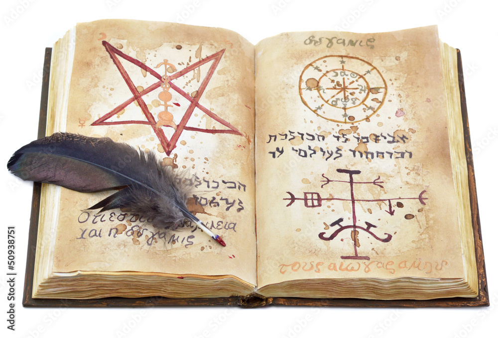 Obraz premium Magic book with feather isolated