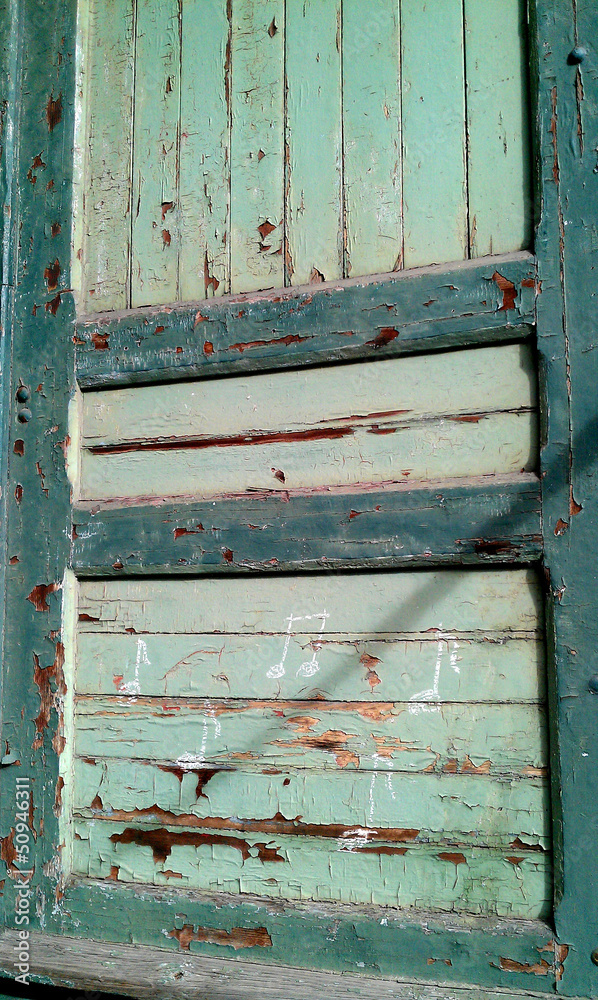 musical notes on green door with peeling paint musical notes on green door with peeling paint