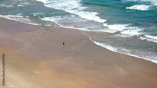 Sea - wide beach with with some lonesone tourist
