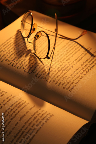 Glasses on an antique book
