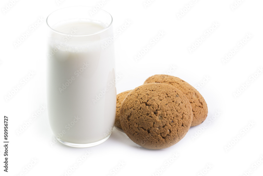 Glass of milk and oatmeal cookies on white Glass of milk and oatmeal cookies on white
