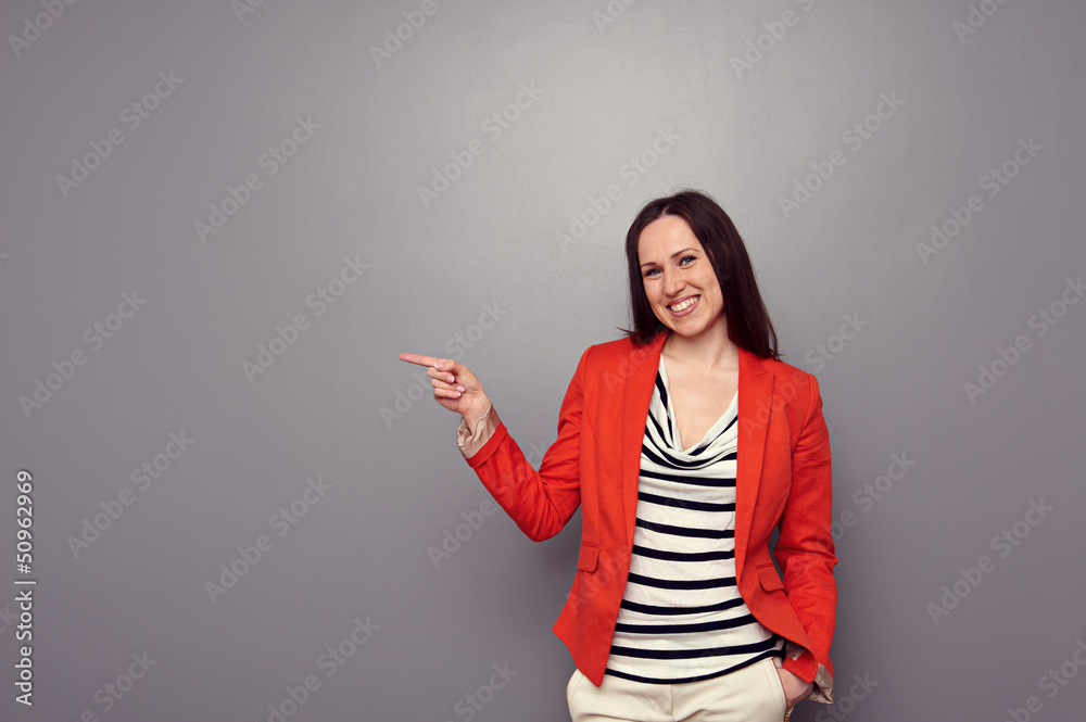happy girl pointing at empty copyspace happy girl pointing at empty copyspace