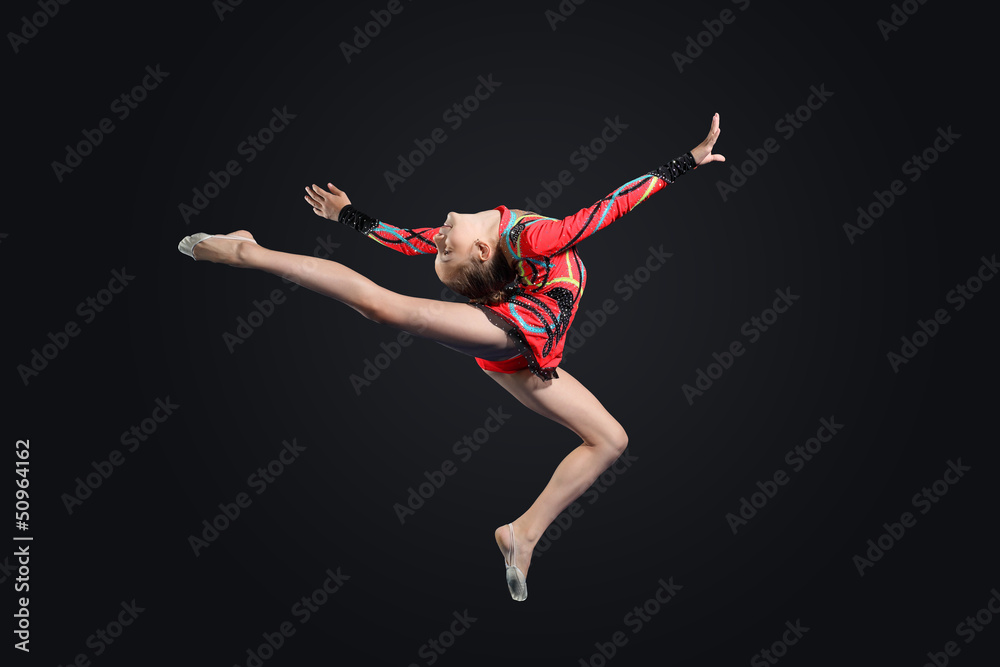 Fototapeta premium Young woman in gymnast suit posing