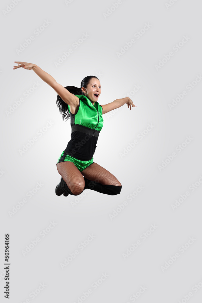 Young female dancer against white background