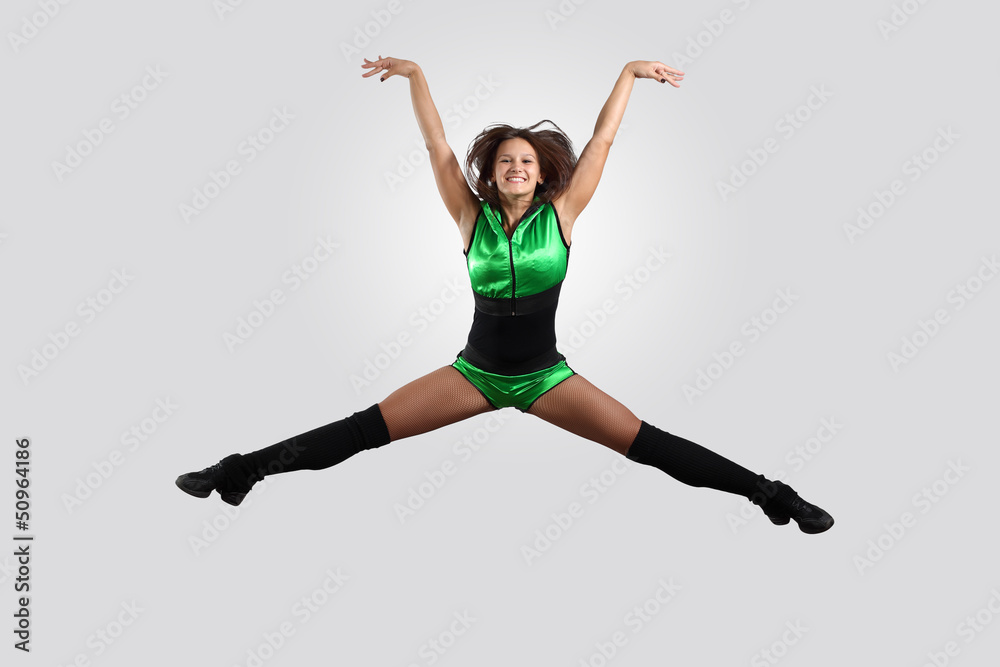 Young female dancer against white background