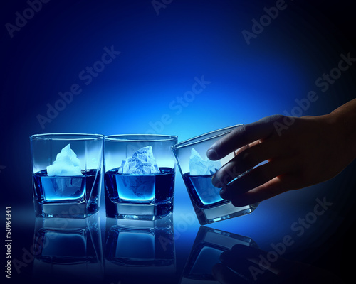 Three glasses of blue liquid © Sergey Nivens