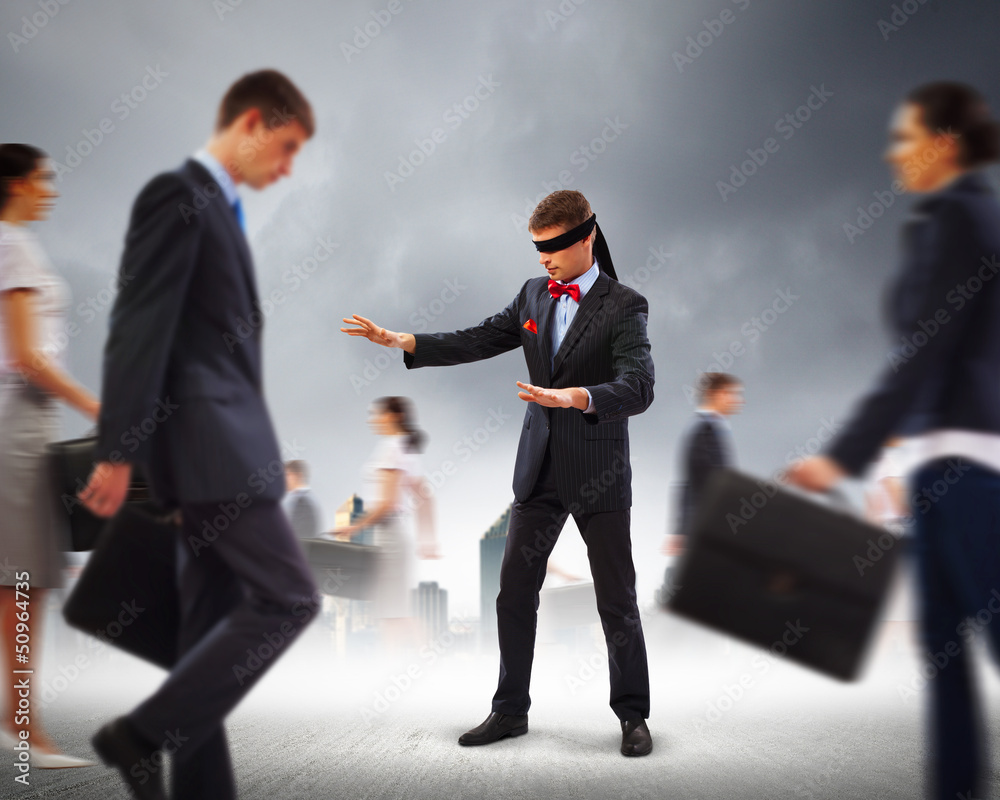 Businessman in blindfold among group of people Businessman in blindfold among group of people
