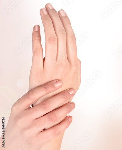Beautiful woman hands isolated on a white background
